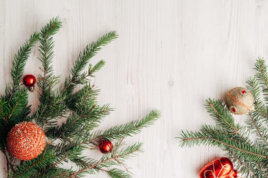 Christmas Composition on a White Wooden Table with Copy Space Text