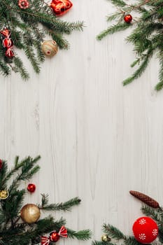 Christmas Red Decorations on a White Wooden Table with Copy Space Text