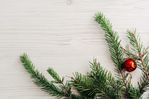 Christmas Composition on a White Wooden Table with Copy Space Text