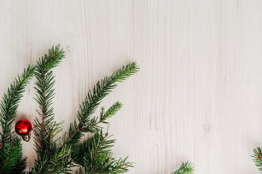 Christmas Composition on a White Wooden Table with Copy Space Text