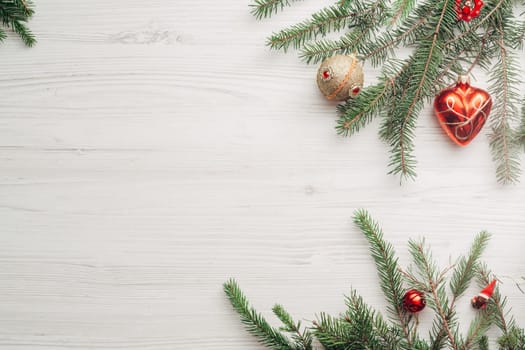 Christmas Composition on a White Wooden Table with Copy Space Text