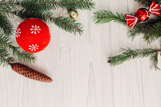 Christmas Composition on a White Wooden Table with Copy Space Text
