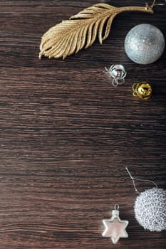 Decoration of Christmas Tree Green Branches on a Brown Background with Copy Space