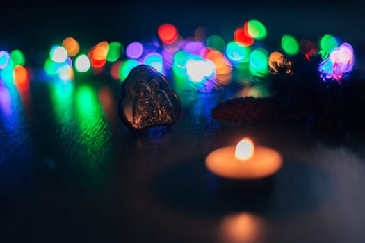 Christmas Composition of Church Icon on a Wooden Background With Multicolored Light Boken