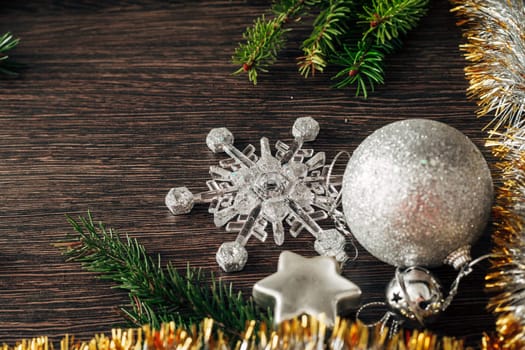 Decoration of Christmas Tree Green Branches on a Brown Background with Copy Space