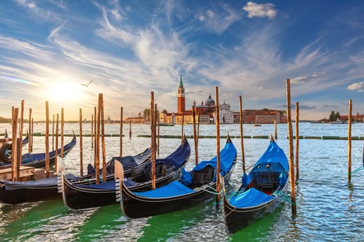 The island of San Giorgio Maggiore and traditional gondolas of Venice, Italy.