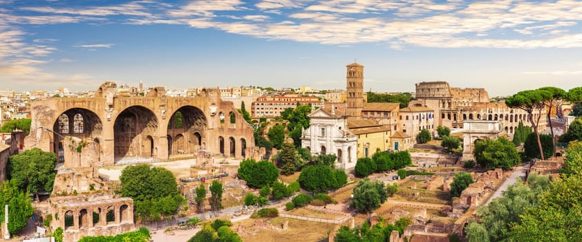 Roman Forum full panorama, view of the Basilica of Maxentius and Constantine, House of the Vestals and the Coliseum, Italy.