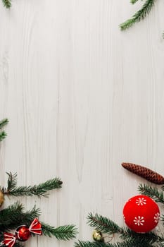 Christmas Composition on a White Wooden Table with Copy Space Text