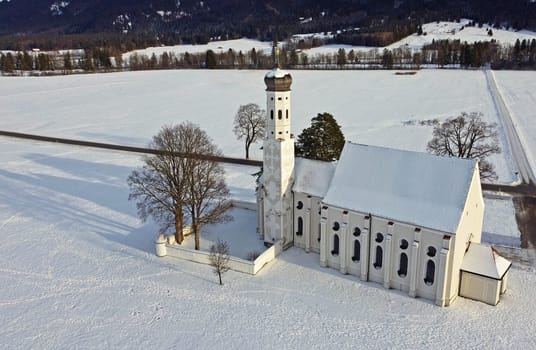 Drone shot of the famous baroque Colomanskirche near Schwangau in Bavaria in winter