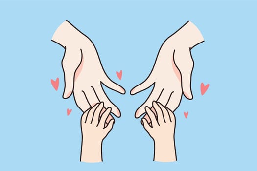 Small kid hold mom hands show love and care