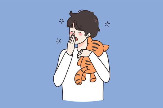 Tired small boy child with toy yawn feel fatigue want sleep. Exhausted small teen kid with teddy bear ready for bed in evening. Drowsiness and exhaustion. Childcare concept. Flat vector illustration.