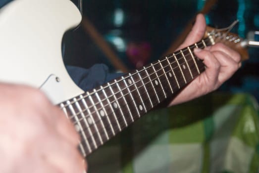 Tuning an electric guitar with tuner