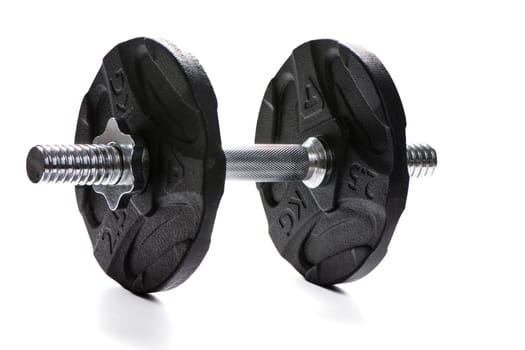Metal dumbbell with black pancakes and chrome fingerboard on a white insulated background. High quality photo
