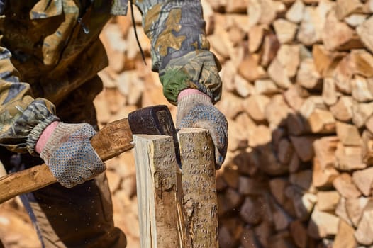 chopping firewood with an axe close-up. High quality photo