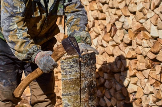 chopping firewood with a chopper close-up on a sunny day. High quality photo
