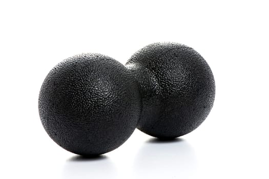 black double massage ball close-up for yoga on white isolated background. High quality photo