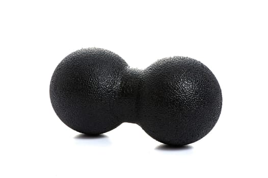 black double massage ball close-up for yoga on white isolated background. High quality photo