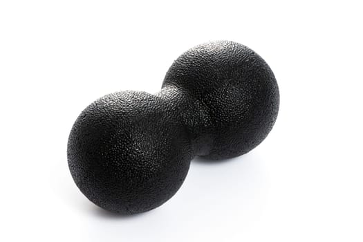 black double massage ball close-up for yoga on white isolated background. High quality photo
