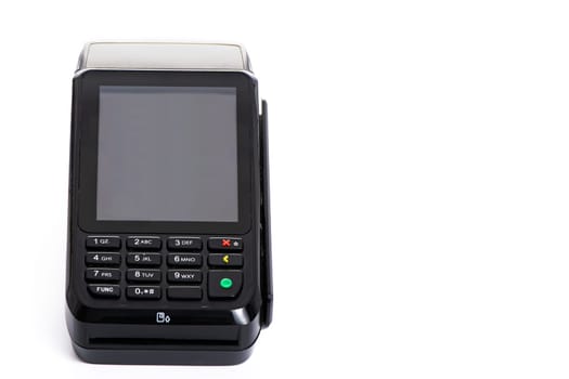 black payment terminal close-up for accepting money from plastic cards from customers on a white isolated background, copy space. High quality photo