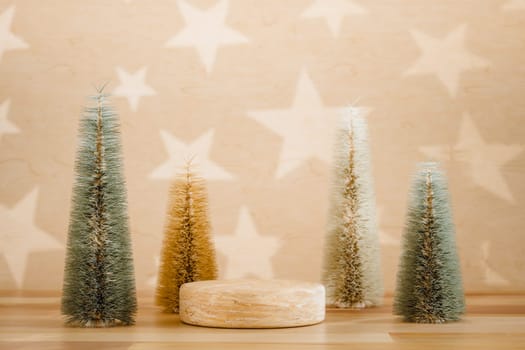 Wooden podium pedestal product mockup display with miniature Christmas trees in beige and green, 3d illustration