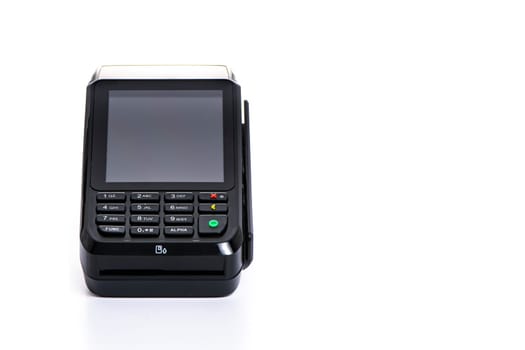 black payment terminal close-up for accepting money from plastic cards from customers on a white isolated background, copy space. High quality photo