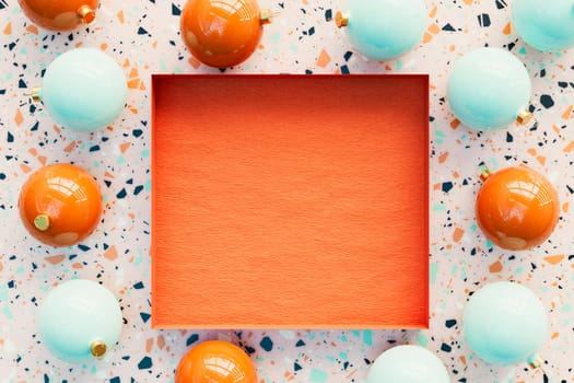 3D rendering of a Christmas terrazzo background with baubles around an empty box in the center with copy space for text