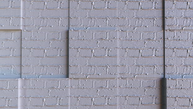 Architectural masonry with 3d render of square cutouts. Fashionable style of construction with rough brick blocks and layers of hardened mortar. Urban minimalism of buildings with simple design.