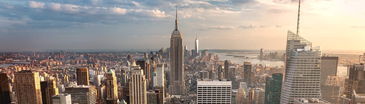 New York City skyline with urban skyscrapers at sunset, USA.