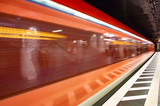 Frankfurt, Germany - March 3, 2019: blurred motion of metro train entering the train station in Frankfurt