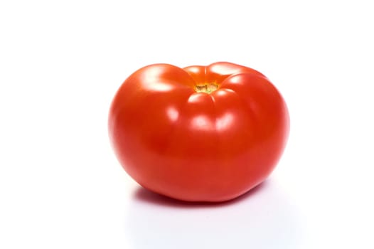 Juicy red tomato on a white isolated background. High quality photo
