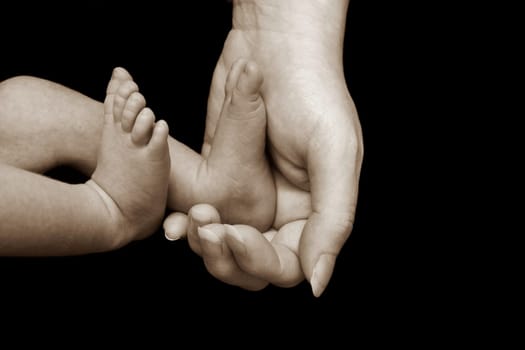 Baby fuesse in mother's hand