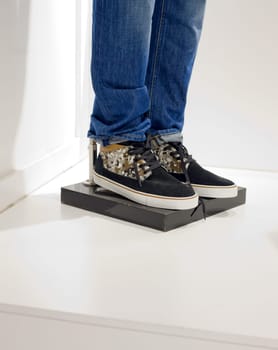 Mannequins legs with casual basic wear. Jeans and sneakers