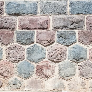 Basalt blocks lined. Close up of a wall of stone.