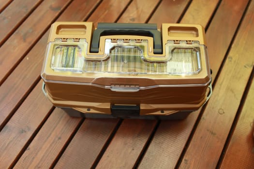 plastic toolbox on the floor top view still life