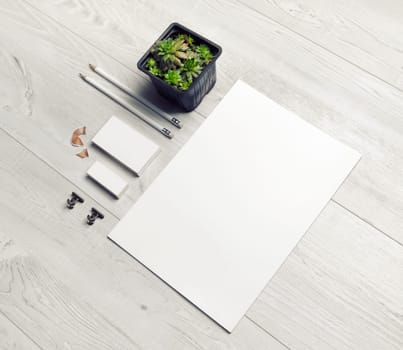 Blank stationery set on light wooden background. Corporate identity template. Responsive design mockup.