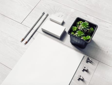 Blank stationery template on light wooden background. Mockup for design presentations and portfolios.