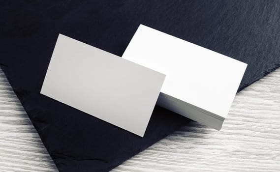 Photo of blank white business cards. Branding mockup.