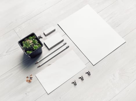 Blank stationery set on light wooden background. Template for branding design.