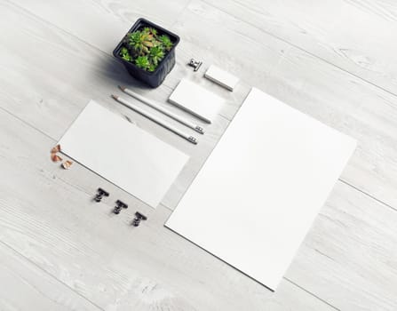 Stationery mock up. Blank corporate identity template on light wooden background. Responsive design mockup.