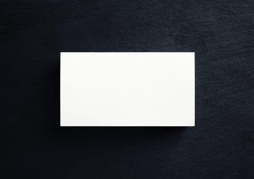 Blank white business card. Mock-up for branding identity. Top view. Flat lay.