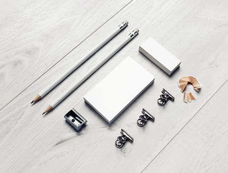 Blank stationery and corporate identity template on light wooden background. Responsive design mockup.