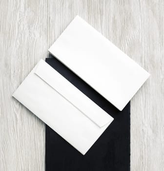 Two blank envelopes. Front and back side. Template for branding identity. Top view. Flat lay.