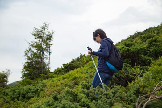 Girl Descend Down a Large Green Mountain Range.