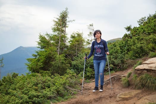 Girl Descend Down a Large Green Mountain Range.