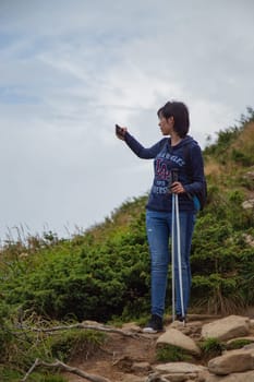 Girl Descend Down a Large Green Mountain Range.
