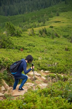 Girl Descend Down a Large Green Mountain Range.