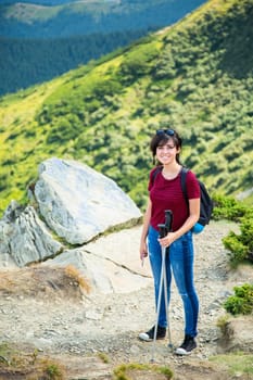 Girl Descend Down a Large Green Mountain Range.