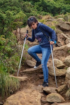 Girl Descend Down a Large Green Mountain Range.