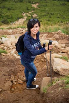 Girl Descend Down a Large Green Mountain Range.