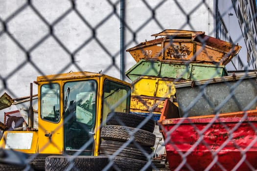 Areal with big old and rusty metal container for renting